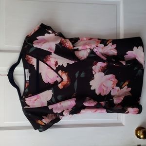 Women’s stunning black blouse with pink flowers, v neck and ruffles on sleeves.
